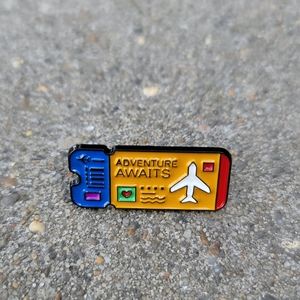 3/$30 Adventure Awaits Travel Ticket Enamel Pin
